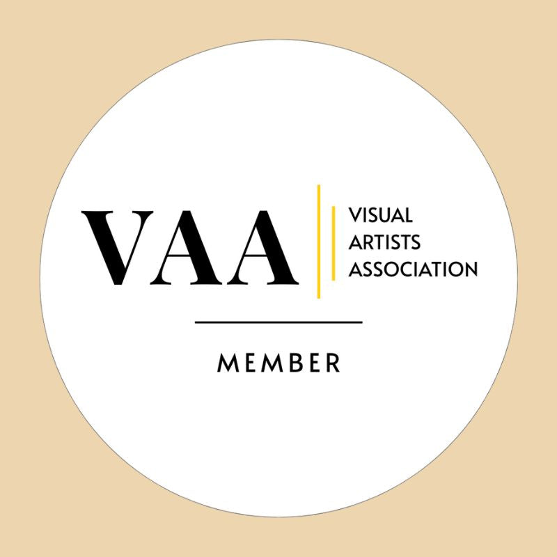 Circular sticker with VAA (Visual Artists Association) Member logo on a beige background